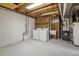 Unfinished laundry room featuring washer, dryer, utility sink, exposed ductwork, and concrete flooring at 2427 S Eldridge Ct, Lakewood, CO 80228