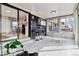 Bright sunroom featuring stainless bar stools at 2427 S Eldridge Ct, Lakewood, CO 80228