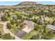 Expansive aerial view of the property showcasing a well-maintained home with mature trees and landscaping in a beautiful community at 1590 Longview Cir, Monument, CO 80132