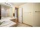Bright bathroom with double sinks and light wood cabinets offering ample storage space at 1590 Longview Cir, Monument, CO 80132