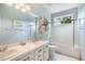 Bathroom featuring tub and shower combination, vanity with double sinks, and natural light at 1590 Longview Cir, Monument, CO 80132