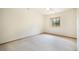 Clean bedroom with neutral carpet, trim, and window overlooking natural landscape at 1590 Longview Cir, Monument, CO 80132