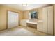 Bright bedroom offers built-in desk space, storage, and a closet at 1590 Longview Cir, Monument, CO 80132