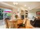 Cozy dining area with sliding doors to a deck, fireplace, and comfortable seating for everyday meals or entertaining at 1590 Longview Cir, Monument, CO 80132