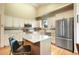 Bright kitchen with an island, stainless steel appliances, modern cabinets, and an eat in kitchen at 1590 Longview Cir, Monument, CO 80132