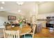 Open-concept living area with dining space, modern kitchen, and a cozy living room perfect for Gathering gatherings at 1590 Longview Cir, Monument, CO 80132