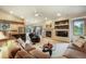 Inviting living room features a fireplace, vaulted ceilings, and a seamless flow into the modern kitchen at 1590 Longview Cir, Monument, CO 80132