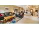 Spacious living room with carpet, natural lighting, a fireplace, and sliding glass door to the outside at 1590 Longview Cir, Monument, CO 80132
