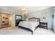 Spacious main bedroom with a ceiling fan, ensuite bathroom, and a walk-in closet at 1590 Longview Cir, Monument, CO 80132
