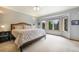 Serene main bedroom featuring a spacious layout, bay window, and plush carpet, a perfect retreat at 1590 Longview Cir, Monument, CO 80132