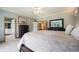 Spacious main bedroom with a ceiling fan, ensuite bathroom, and a walk-in closet at 1590 Longview Cir, Monument, CO 80132
