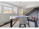 Finished basement with a desk, chair, and bright window, offering a versatile living space at 1922 E 18Th Ave, Denver, CO 80206