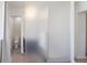 Modern bathroom with frosted glass, tiled walls and a water closet at 1922 E 18Th Ave, Denver, CO 80206