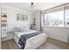 Bright bedroom with a large window, modern furniture, and ample natural light, creating a serene retreat at 1922 E 18Th Ave, Denver, CO 80206