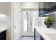 Bright kitchen area featuring white cabinetry, stainless steel appliances, and ample natural light at 1922 E 18Th Ave, Denver, CO 80206