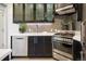 Modern kitchen features stainless steel appliances, sleek cabinetry, and stylish tile backsplash at 1922 E 18Th Ave, Denver, CO 80206