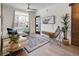 Inviting living room with large window, comfortable seating, and stylish decor creating a cozy ambiance at 1922 E 18Th Ave, Denver, CO 80206