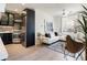 Bright living room and kitchen featuring a modern design, sleek appliances, and stylish furniture at 1922 E 18Th Ave, Denver, CO 80206