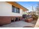 The side yard features brick and concrete planters that add to the appeal of the home at 1922 E 18Th Ave, Denver, CO 80206