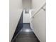 Well-lit stairwell with contrasting black steps and handrail and white walls at 1922 E 18Th Ave, Denver, CO 80206