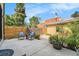 This home's backyard features a cozy seating area and mature landscaping, creating a private outdoor space at 3126 Perry St, Denver, CO 80212