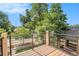 Balcony with wooden flooring and iron railing, offering neighborhood views at 3126 Perry St, Denver, CO 80212