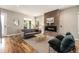 Comfortable living room featuring a modern fireplace, hardwood floors, stylish furnishings, and an inviting atmosphere at 3126 Perry St, Denver, CO 80212