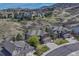 A beautiful neighborhood of houses that backs onto a mountain landscape with clear streets and driveways at 580 Eagle Nest Ct, Golden, CO 80401