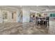Open finished basement with tile flooring and a carpeted staircase leading upstairs at 580 Eagle Nest Ct, Golden, CO 80401