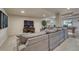 Basement living area with a large gray sectional sofa, TV, and a small pool table at 580 Eagle Nest Ct, Golden, CO 80401