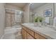 Neutral bathroom featuring a shower/tub combo, single sink vanity, and soft lighting at 580 Eagle Nest Ct, Golden, CO 80401