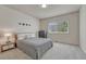 Comfortable bedroom featuring carpeted floor and window with view of the neighborhood at 580 Eagle Nest Ct, Golden, CO 80401