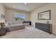 Bright bedroom with a comfortable bed, a large window, and dark wood furniture at 580 Eagle Nest Ct, Golden, CO 80401