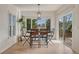 Bright breakfast nook with a view, wood table, and sliding door access to the patio at 580 Eagle Nest Ct, Golden, CO 80401