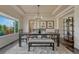 Elegant dining room with a chandelier, large window, and a modern table setting for Gathering gatherings at 580 Eagle Nest Ct, Golden, CO 80401