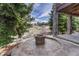 Outdoor firepit with natural views and stone patio at 580 Eagle Nest Ct, Golden, CO 80401