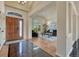 Inviting foyer with a wooden door, decorative tile, and an open view to the living room at 580 Eagle Nest Ct, Golden, CO 80401