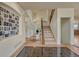 Inviting foyer features detailed tile, hardwood floors, and staircase leading to the second floor at 580 Eagle Nest Ct, Golden, CO 80401