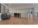 Bright second-floor hallway featuring hardwood floors and a comfortable seating area at 580 Eagle Nest Ct, Golden, CO 80401
