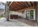 Outdoor hot tub beneath covered patio at 580 Eagle Nest Ct, Golden, CO 80401