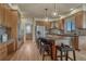 Spacious kitchen with modern appliances, wooden cabinets, granite countertops, and a large island with seating at 580 Eagle Nest Ct, Golden, CO 80401
