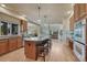 Modern kitchen featuring a spacious island with seating and stainless steel appliances at 580 Eagle Nest Ct, Golden, CO 80401