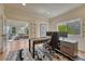 Home office with a large desk, natural light, and view to the living area at 580 Eagle Nest Ct, Golden, CO 80401