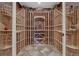 Well-organized wine cellar with ample bottle storage and tile floors at 580 Eagle Nest Ct, Golden, CO 80401