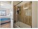 This bathroom features a shower-tub with glass doors and is adjacent to the bedroom at 6760 Meade Cir # C, Westminster, CO 80030