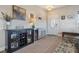 Inviting entryway featuring a stylish sideboard, decor, and convenient bench seating near the front door at 6760 Meade Cir # C, Westminster, CO 80030