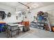 Organized garage space with ample storage, work benches, and bright overhead lighting at 6760 Meade Cir # C, Westminster, CO 80030