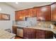Gourmet kitchen featuring stainless steel appliances, custom cabinets, and granite countertops at 6760 Meade Cir # C, Westminster, CO 80030