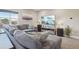 Cozy living room featuring a large sectional sofa, modern entertainment center, and ample natural light at 6760 Meade Cir # C, Westminster, CO 80030