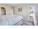 Relaxing bedroom with a door leading to an outdoor balcony, cozy carpet, and neutral walls at 6760 Meade Cir # C, Westminster, CO 80030